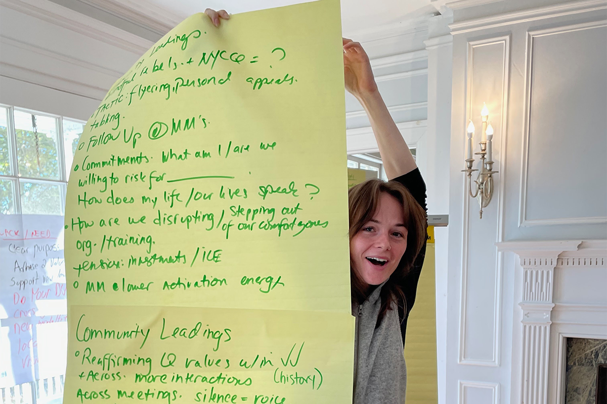 Jess holding up flipchart Oct 2025