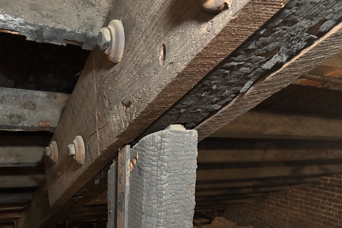 Charred beams sistered BMM attic