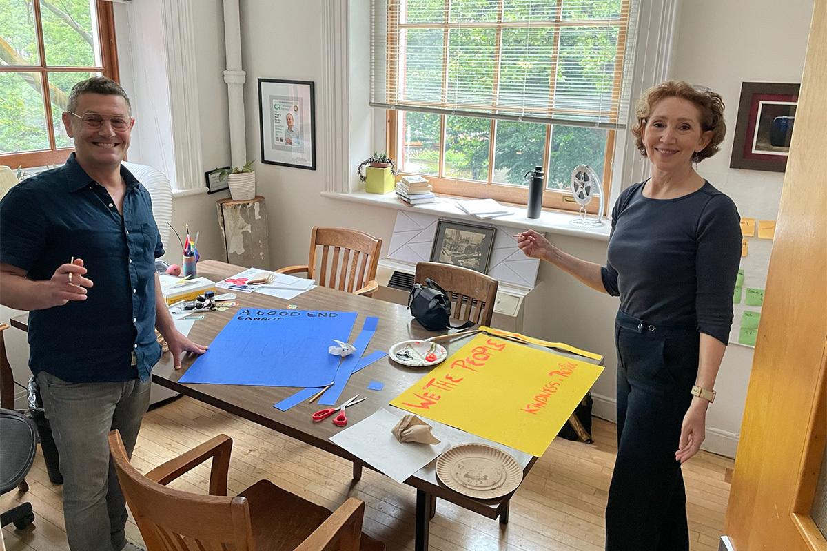 Two Friends at Sign Making No Kings June 2025