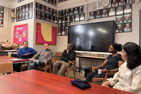 A row of seated teachers at Brooklyn Frontiers High School, part of a panel discussion with NYC Quaker visitors.