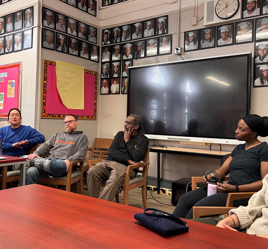 A row of seated teachers at Brooklyn Frontiers High School, part of a panel discussion with NYC Quaker visitors.
